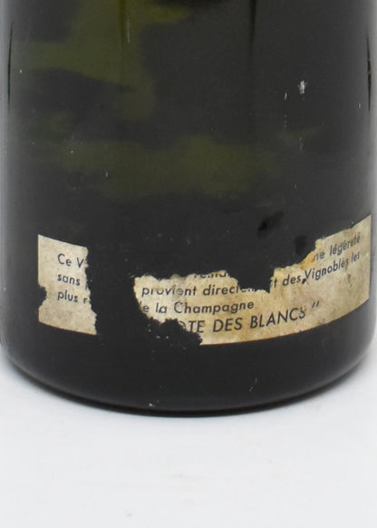 Bouteille de Champagne 1969 étiquette protégée sous film